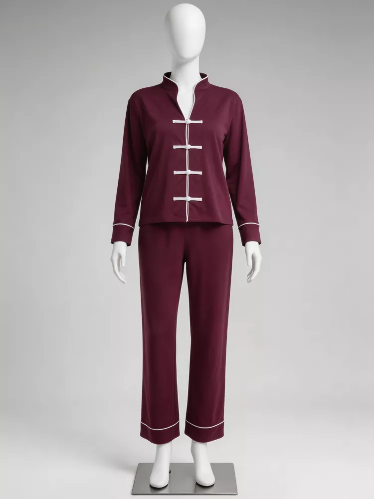 Burgundy long sleeve pajama top and pants set with white contrast piping and frog closures