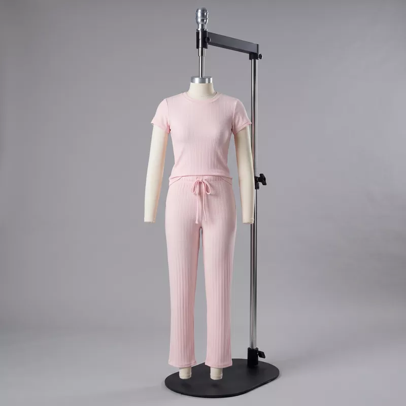 Custom women's pink ribbed 2-piece loungewear set from wholesale clothing supplier.
